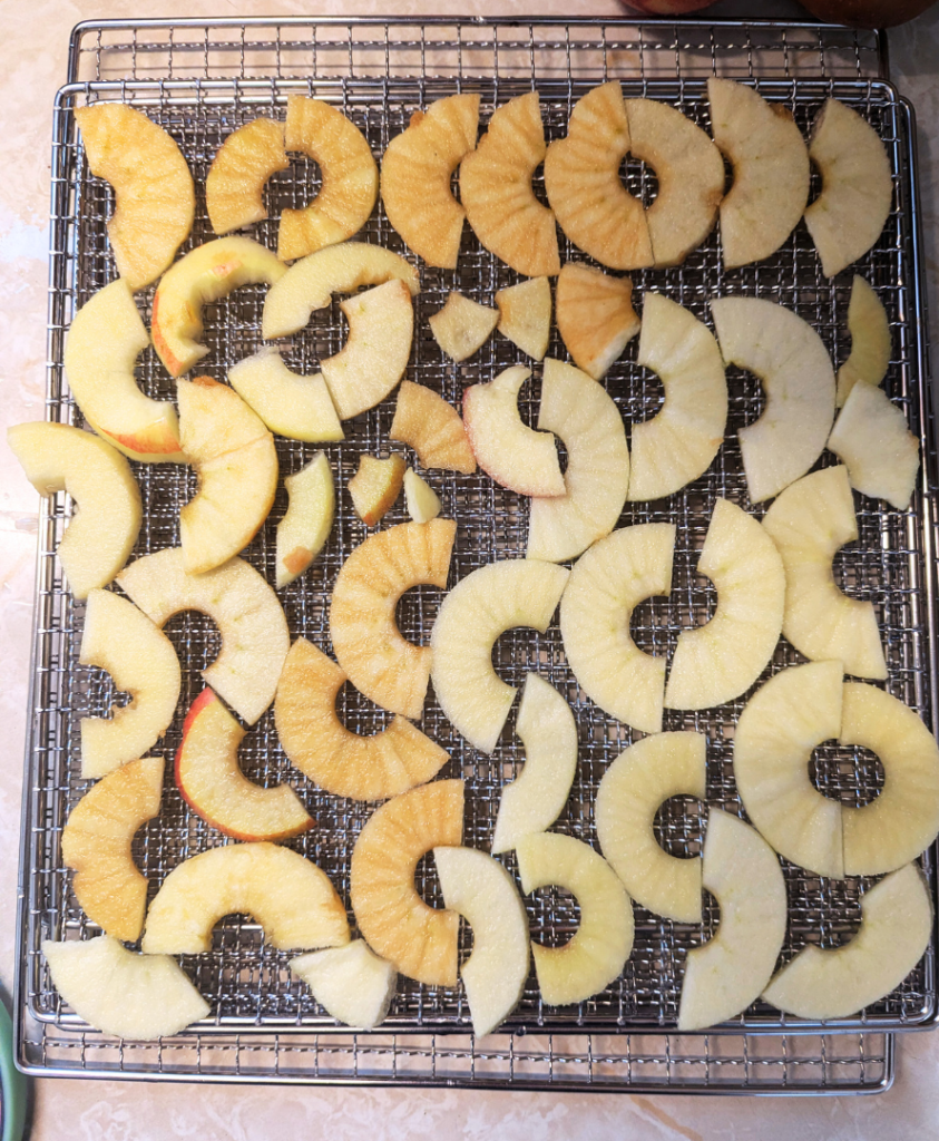 Spreading the apple slices on a tray